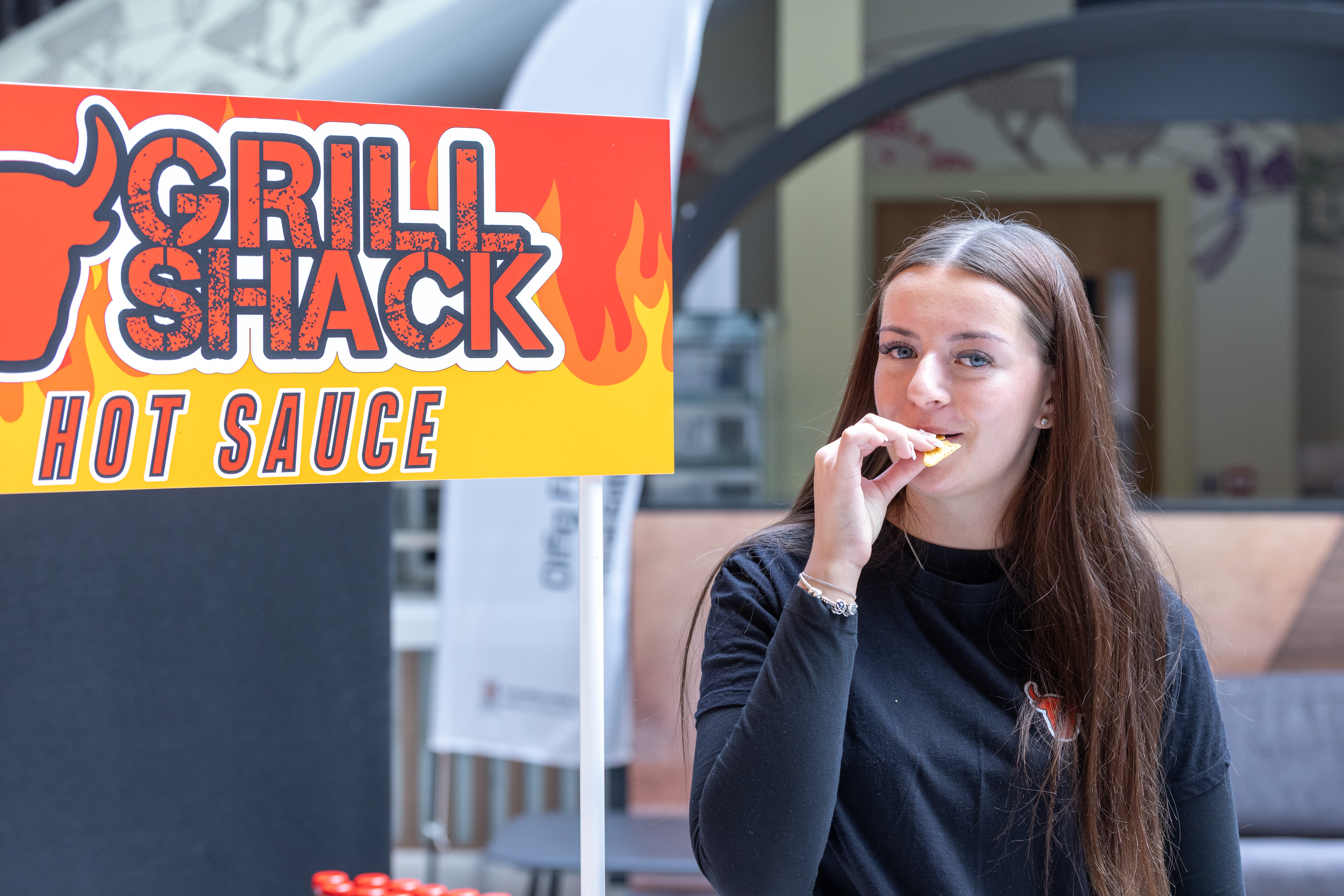 Person with hot sauce stall.